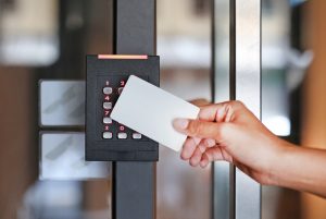 Door,Access,Control,-,Young,Woman,Holding,A,Key,Card